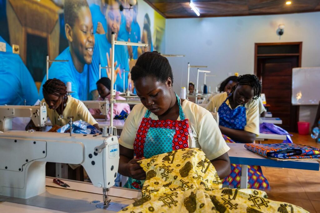 Young Ugandan woman sewing